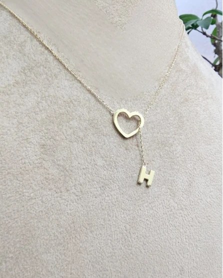 Gold open heart necklace with an initial H drop
