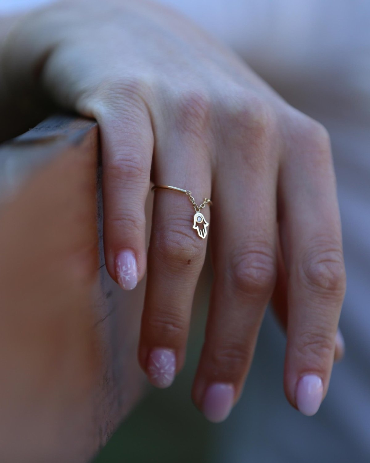 Minimal gold Fatima ring worn by the sea